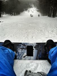 People in ski lift over snow