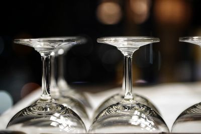 Close-up of wine glasses on table