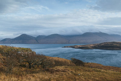 Scenic view of lake and mountains against sky