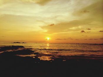 Scenic view of sea at sunset