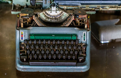 High angle view of old machine on table