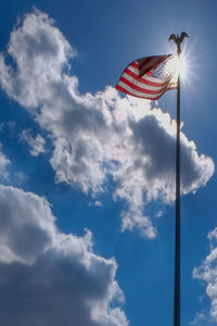 Low angle view of flag against sky