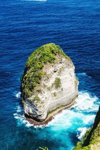 High angle view of rock formation in sea