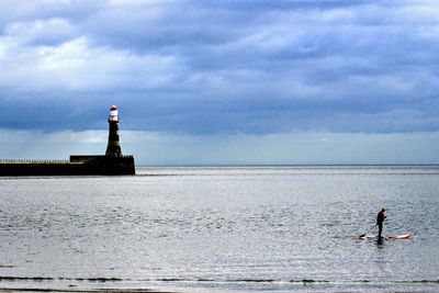 Man on sea against sky