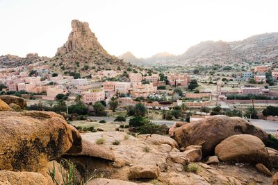 Aerial view of townscape against mountains