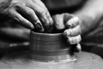 Hands of a potter. potter making ceramic pot on the pottery wheel