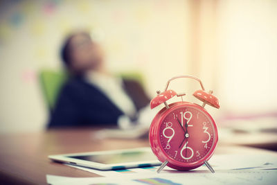 Close-up of clock on table