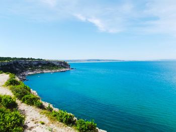 Scenic view of bay against sky