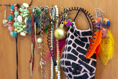 Close-up of decoration hanging on wood