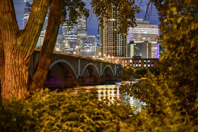 Arch bridge over river in city