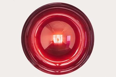 Close-up of red object over white background