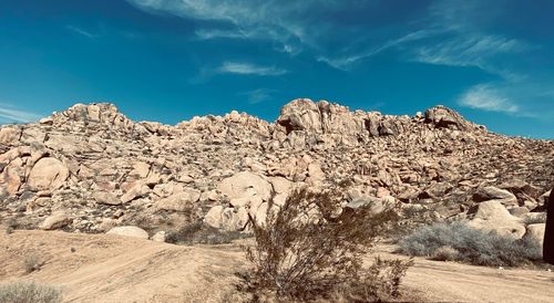 Rock formations on land against sky