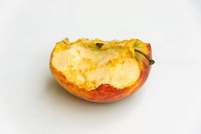 Close-up of orange slice against white background