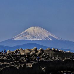 Scenic view of snowcapped mountain against clear blue sky