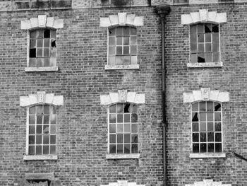 Low angle view of windows on wall of building