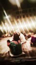 Rear view of people enjoying at music concert