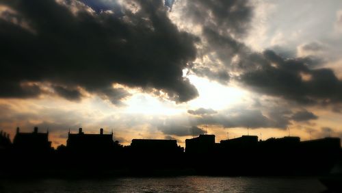 Clouds over city at sunset