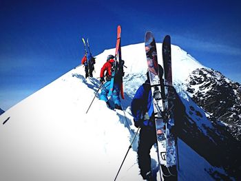 Low angle view of man on mountain against clear sky