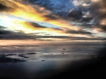 Scenic view of sea against cloudy sky