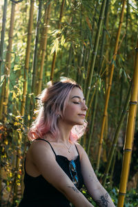 Young woman looking away outdoors