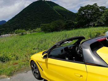 Yellow car on road