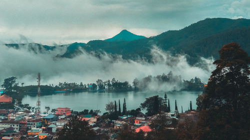 Panoramic view of trees and mountains against sky