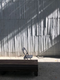 View of empty bench on wall