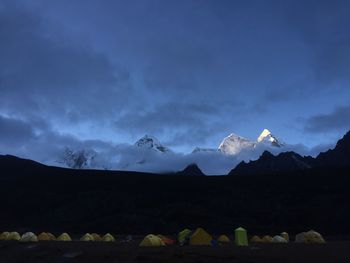 Scenic view of silhouette mountains against sky at dusk