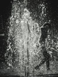 View of people splashing water