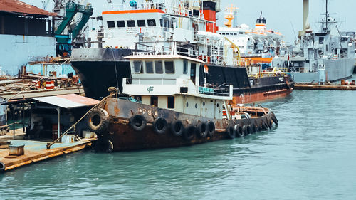 Boats moored at harbor