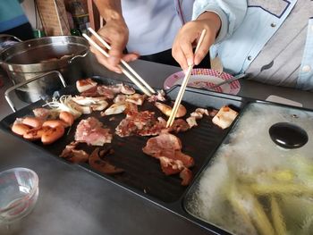 Midsection of man preparing food