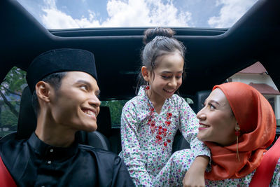 Asian muslim family feeling happy return to the village to celebrate eid with grandparents 