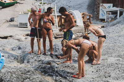 Full length of friends on beach