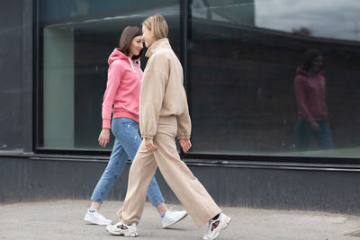 Rear view of couple holding hands