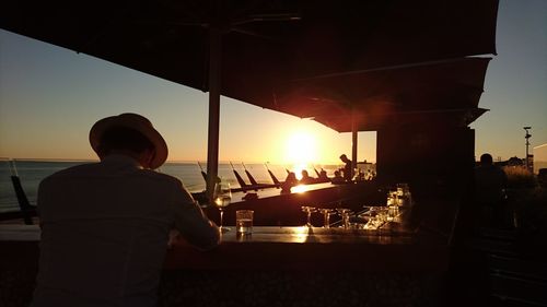 Silhouette of man standing in front of trees