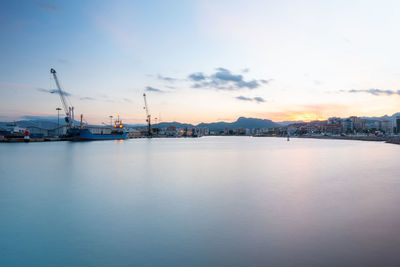 Long exposure photography in the port at sunset.