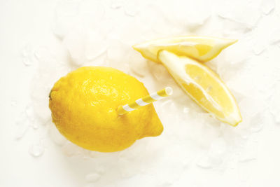 High angle view of lemon slice over white background