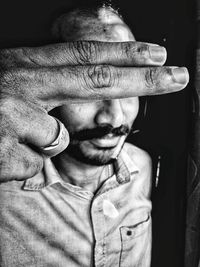 Close-up portrait of man wearing mask