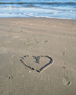 Heart shape on sand at beach