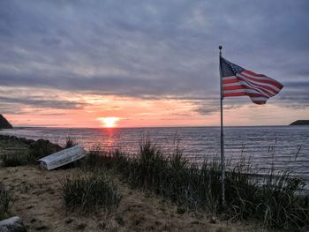 American flag at lakeside