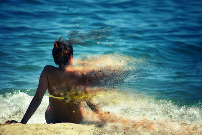 High angle view of waves splashing in sea