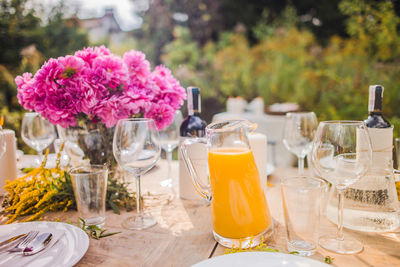 Flowers in glass vase on table