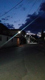 Illuminated city against sky at night