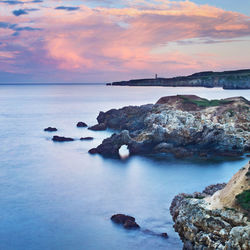 Scenic view of sea against sky at sunset