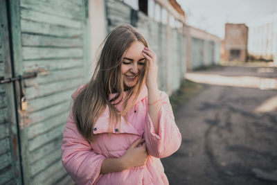 Smiling woman standing outdoors