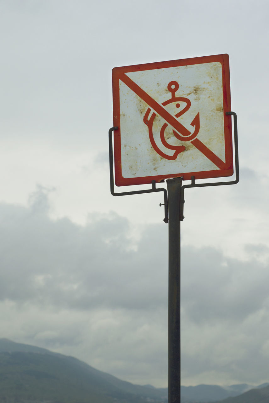 LOW ANGLE VIEW OF SIGN AGAINST SKY