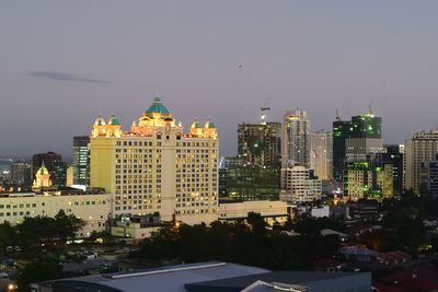 Illuminated buildings in city at night