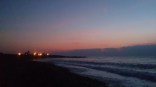 Scenic view of sea against sky at sunset