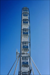 Low angle view of bridge against clear blue sky