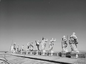 Statues against sky